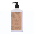 Aluram Golden Glow Body Lotion 18oz | Available at Suri & Noreen Salon, Tequesta FL